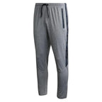 Gray jogger pants with a drawstring on a white background