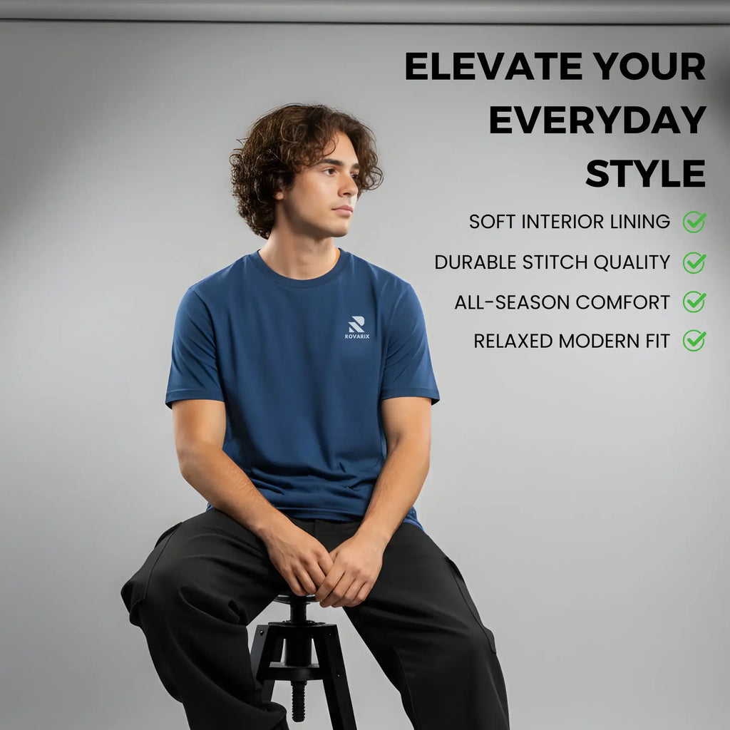 Man sitting on a stool wearing a blue t-shirt with text highlighting product features.