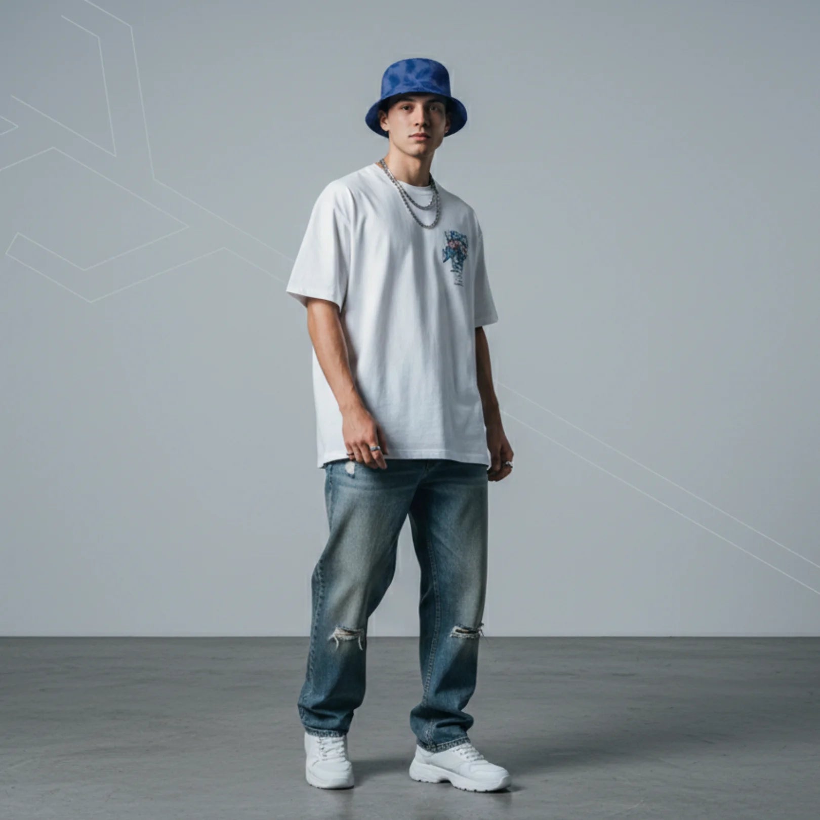 Young man wearing Rovarix blue tropical palm print bucket hat with white tee and streetwear style