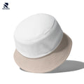 Rovarix reversible bucket hat showing white side and beige side two-in-one design