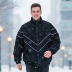 Man wearing Rovarix black stealth chevron windbreaker jacket outdoors walking in urban setting