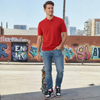 Man wearing Rovarix slim-straight stretch medium indigo jeans walking in urban street