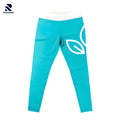 Rovarix turquoise yoga pants showing white contrast waistband and leaf design graphic detail