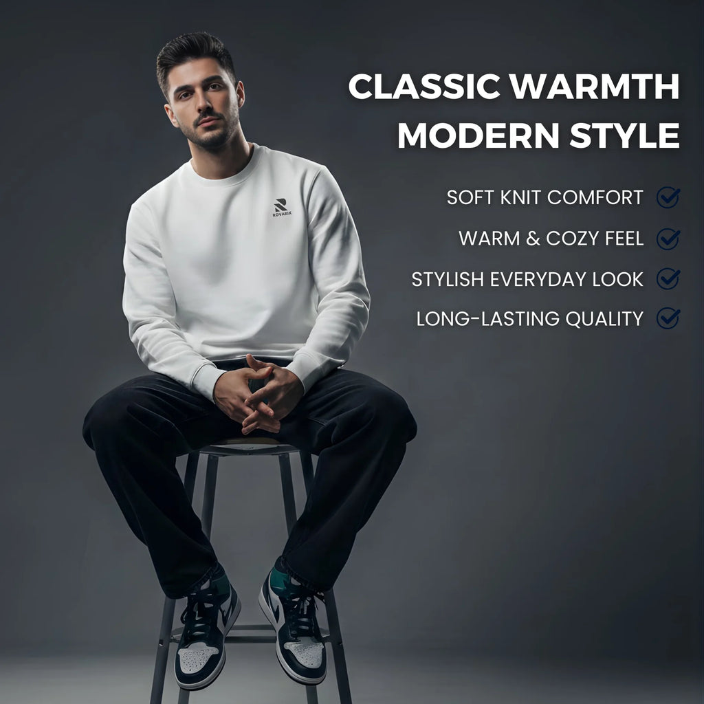 Man sitting on a stool wearing a white Roavrix sweatshirt with text highlighting features on a dark background