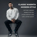 Man sitting on a stool wearing a white Roavrix sweatshirt with text highlighting features on a dark background