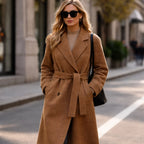 Woman wearing Rovarix camel wool-blend wrap coat with belt and sunglasses walking
