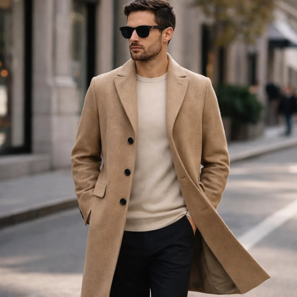 Man wearing Rovarix camel wool-blend overcoat with cream sweater and sunglasses walking